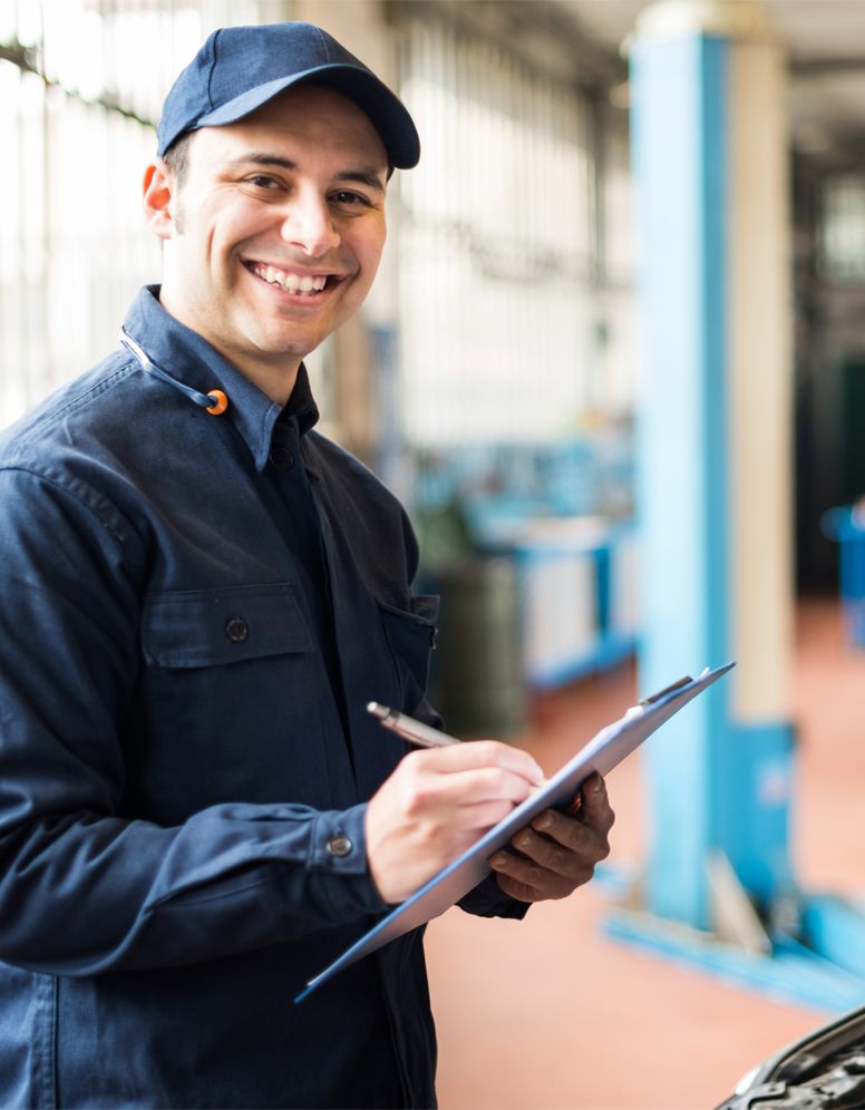 Mechanic performing a Car MOT Plympton